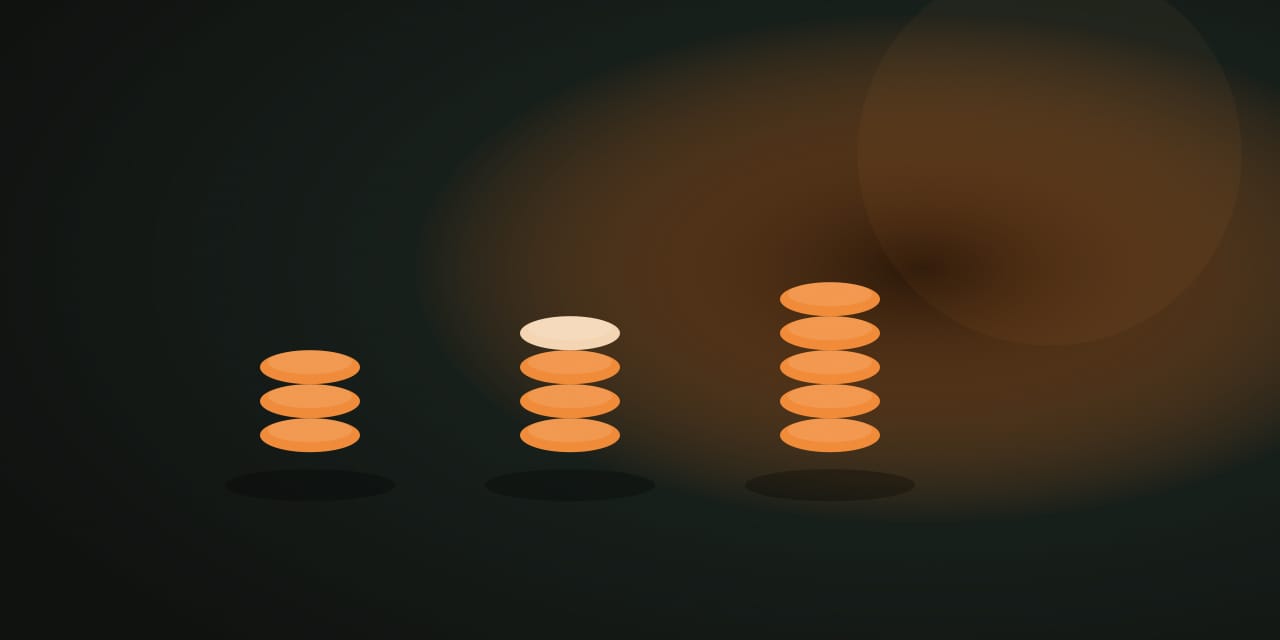 Three orange token piles on a dark table, one pile already partly taken